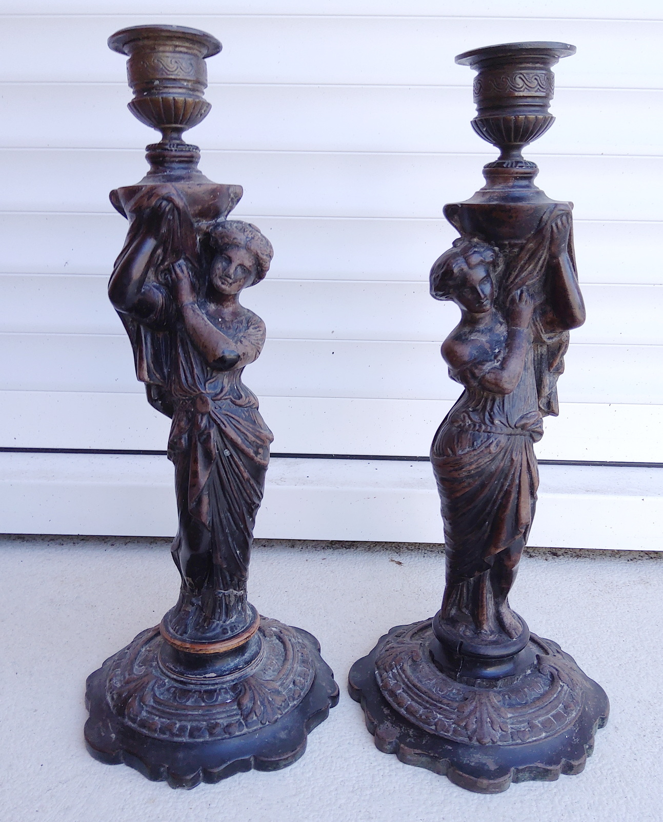A pair of Caryatid Candlesticks